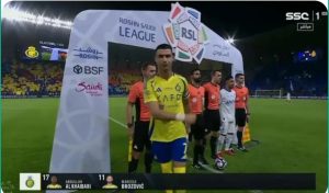 A strange shot: Cristiano Ronaldo ignores Salem Al-Dosari and refuses to look at him or shake his hand before the start of the derby between Al-Nasr and Al-Hilal.